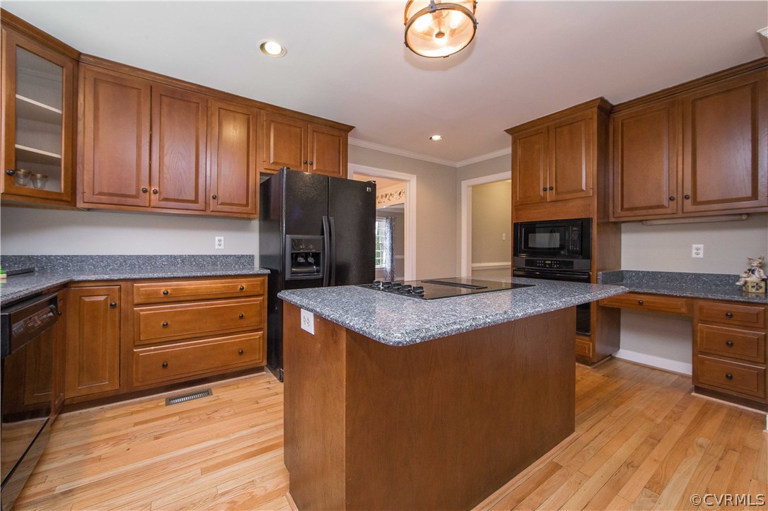 14430 West Salisbury Road Midlothian, VA 23113 - Photo 12 of 36 a kitchen with kitchen island granite countertop wooden cabinets stainless steel appliances and a counter space