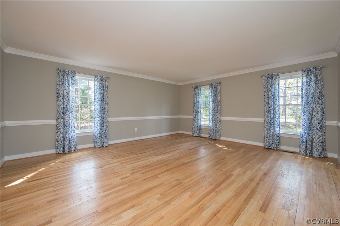 14430 West Salisbury Road Midlothian, VA 23113 - Photo 16 of 36 an empty room with wooden floor and windows