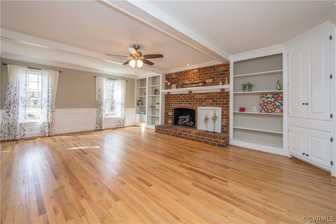 14430 West Salisbury Road Midlothian, VA 23113 - Photo 5 of 36 an empty room with wooden floor fireplace and windows