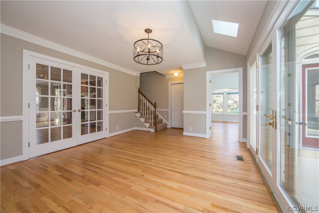 14430 West Salisbury Road Midlothian, VA 23113 - Photo 7 of 36 a view of an empty room with wooden floor and a window