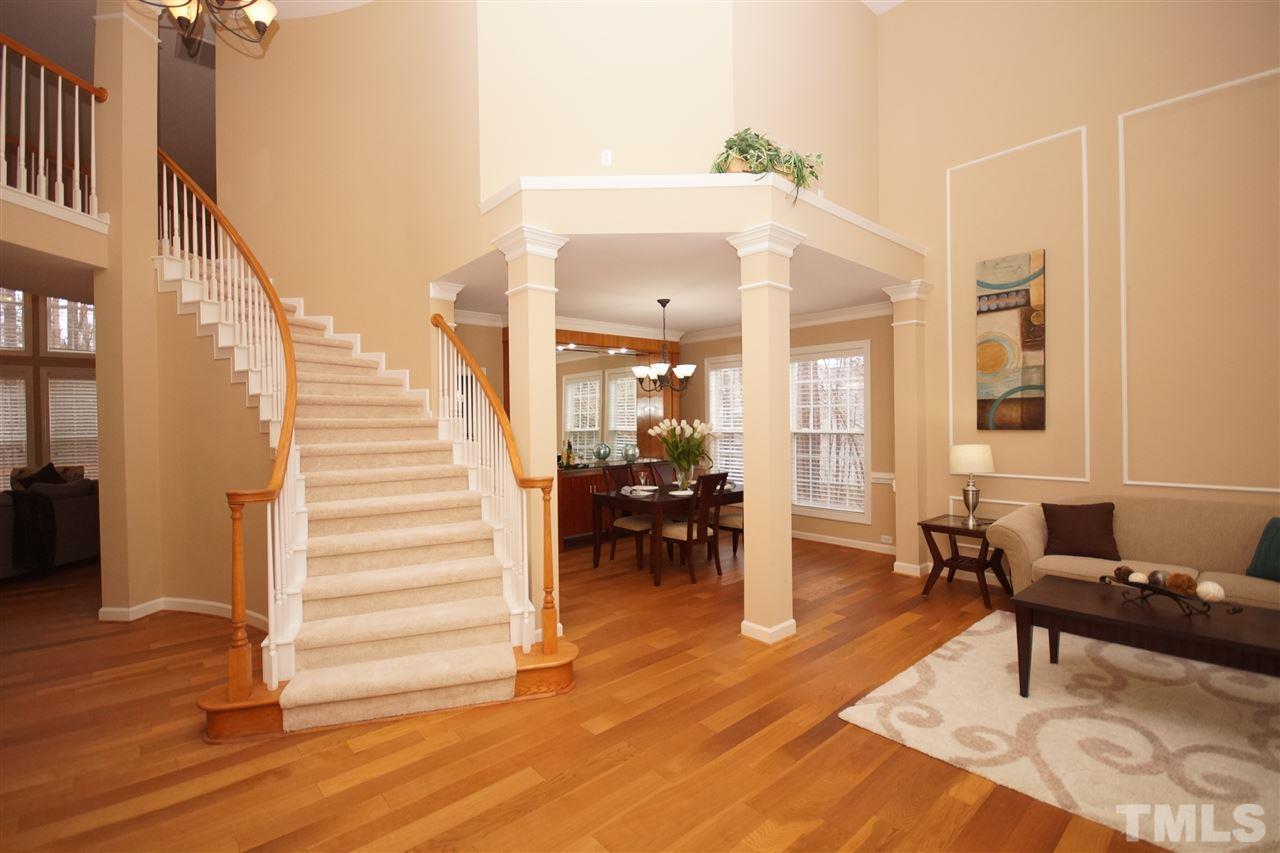 12520 Amoretto Way Raleigh, NC 27613 - Photo 2 of 25 a living room with furniture and a table