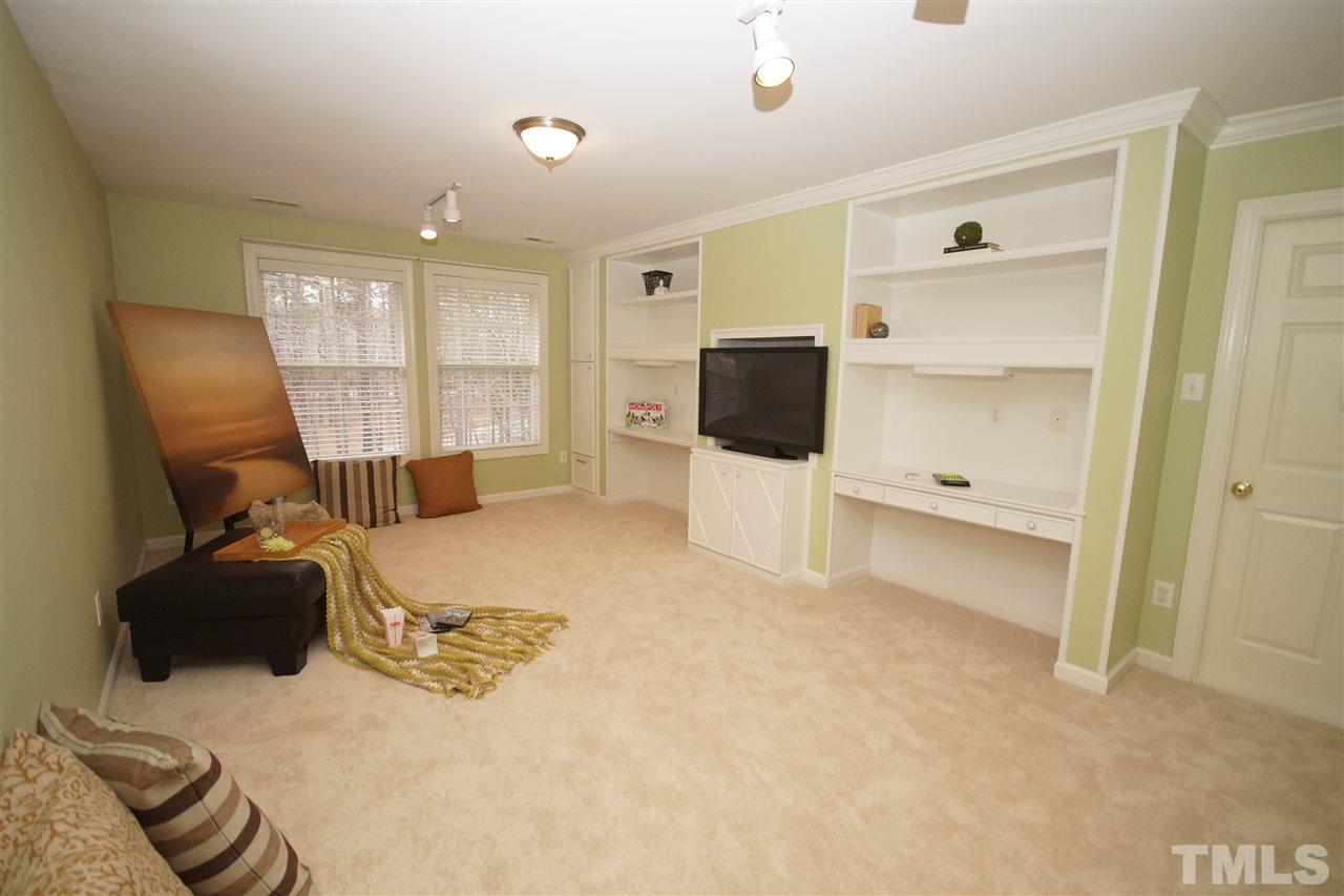 12520 Amoretto Way Raleigh, NC 27613 - Photo 20 of 25 a bed room with a bed and furniture