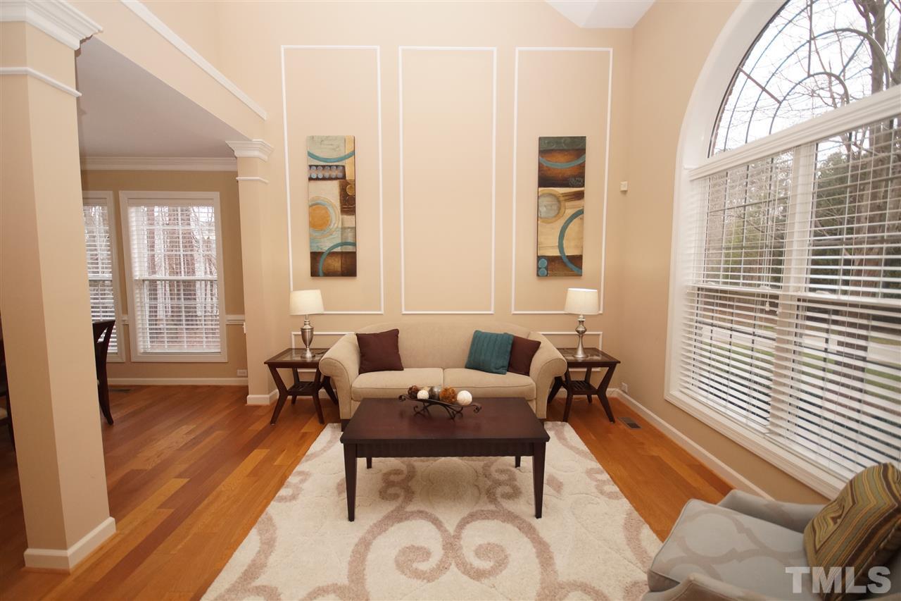 12520 Amoretto Way Raleigh, NC 27613 - Photo 3 of 25 a view of a dining room with furniture and wooden floor