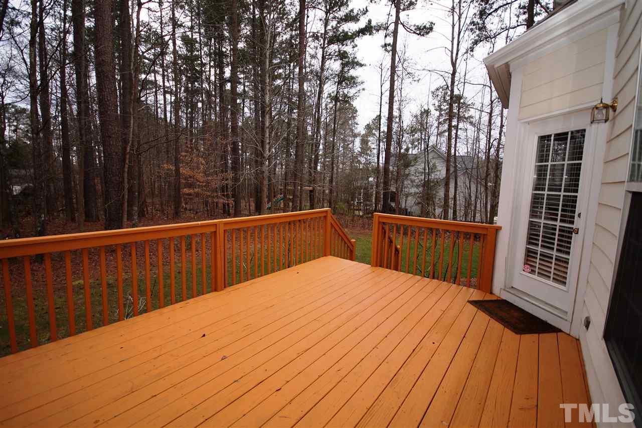 12520 Amoretto Way Raleigh, NC 27613 - Photo 24 of 25 a balcony with trees in front of it