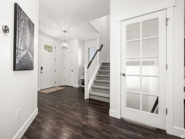 117 Ridge View Drive Elk Ridge, UT 84651 - Photo 14 of 42 Entryway with dark wood-style flooring and suspended lighting