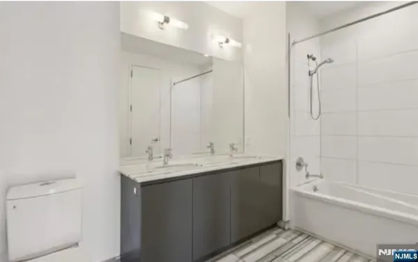 a bathroom with a bathtub and a sink