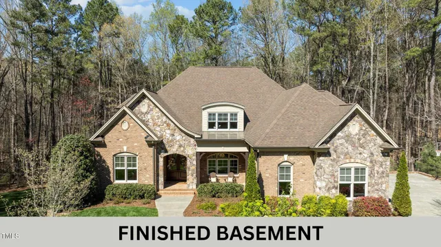 a aerial view of a house with a yard
