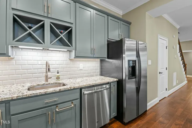a bedroom with bed and a chandelier