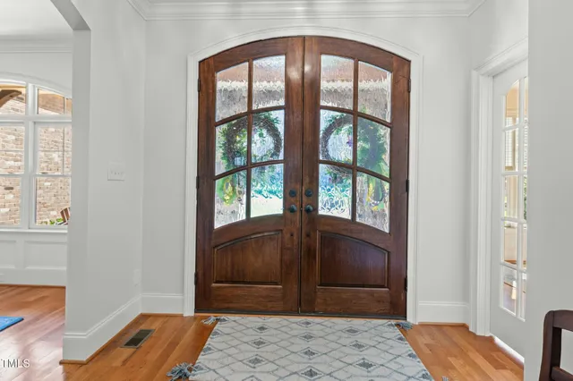 a view of house with a fountain and a potted plant