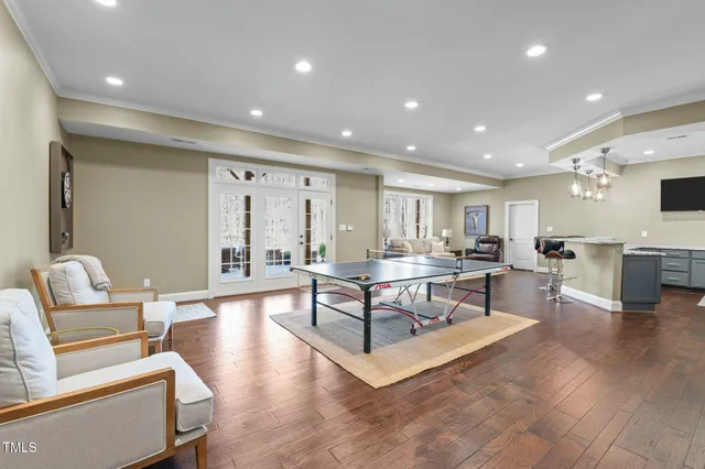 a living room with a bed furniture and a window