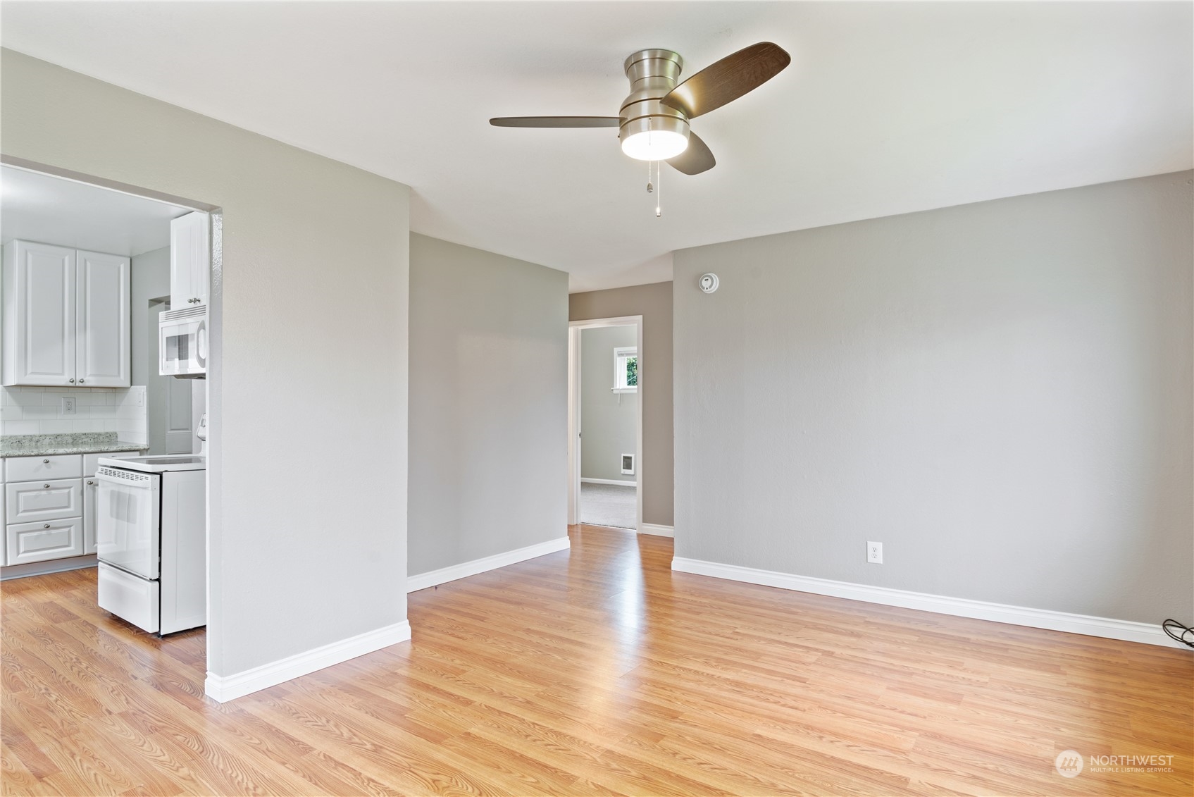 3153 Florida Street Longview, WA 98632 - Photo 12 of 27 a view of a kitchen with wooden floor and a sink