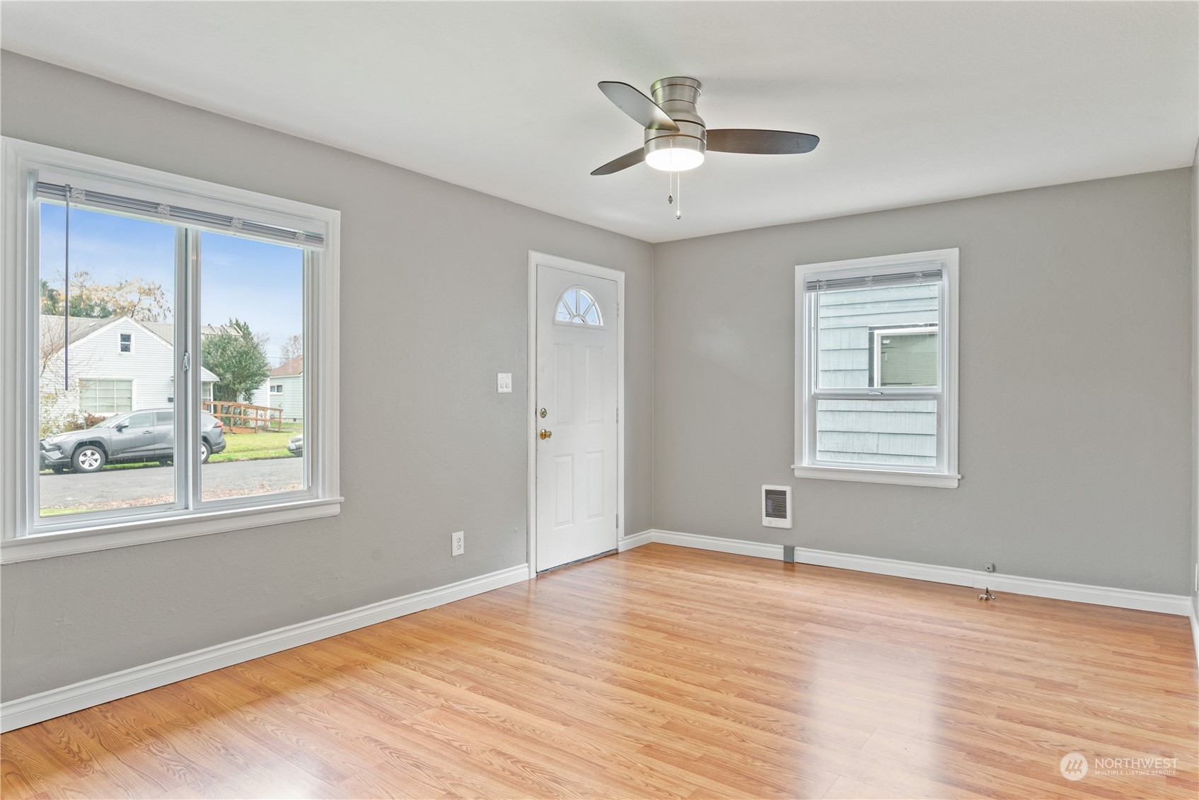 3153 Florida Street Longview, WA 98632 - Photo 13 of 27 a view of an empty room with wooden floor and a window