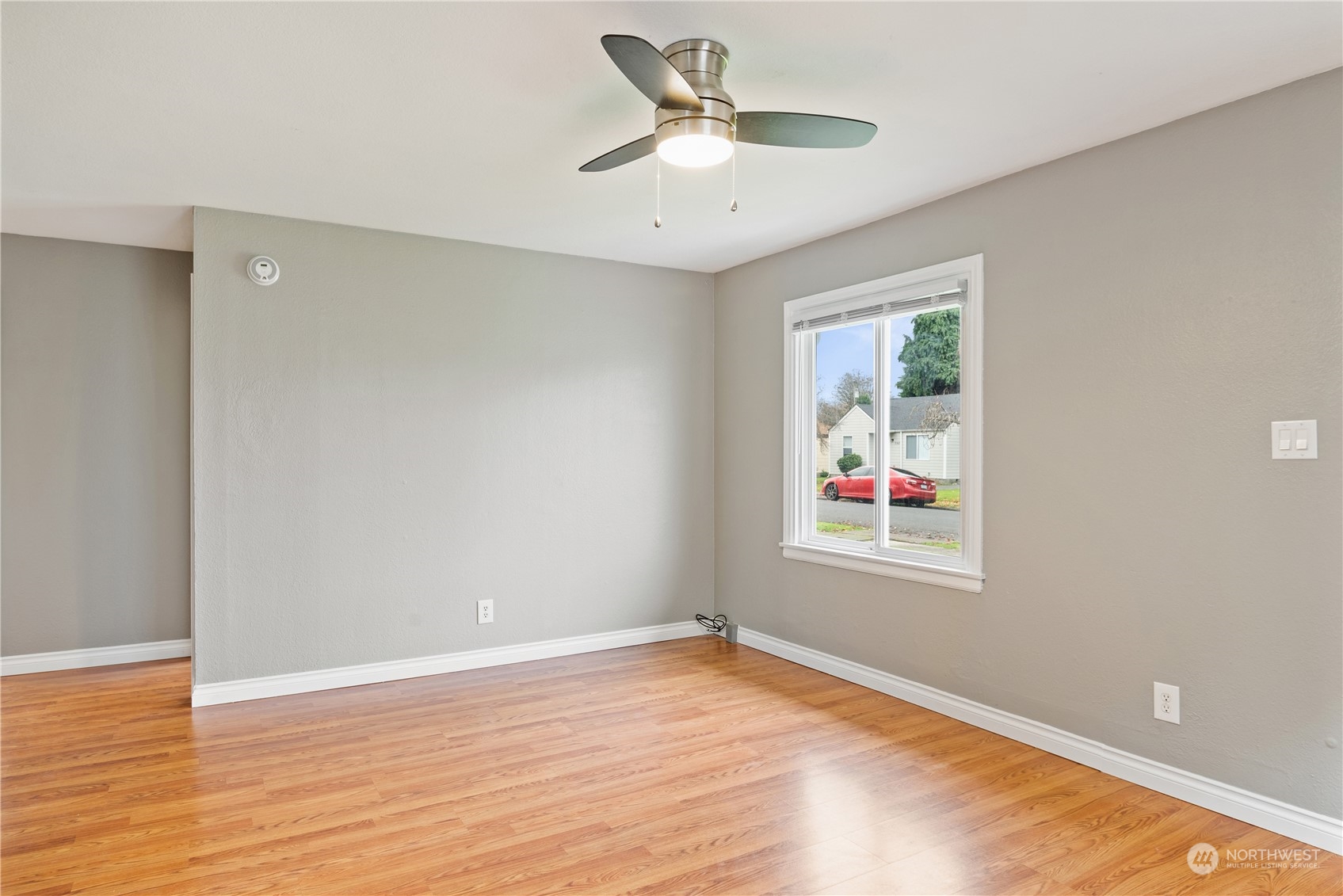 3153 Florida Street Longview, WA 98632 - Photo 14 of 27 wooden floor in an empty room with a window