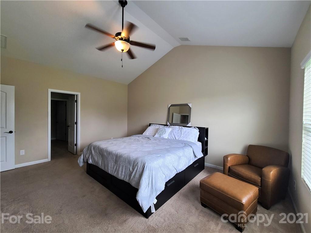 79315 Ridgehaven Road Lancaster, SC 29720 - Photo 16 of 41 a bedroom with a bed and a ceiling fan