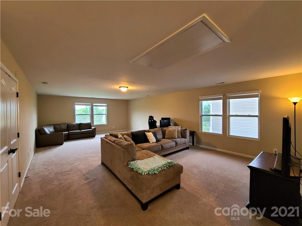 79315 Ridgehaven Road Lancaster, SC 29720 - Photo 22 of 41 a living room with furniture and a flat screen tv