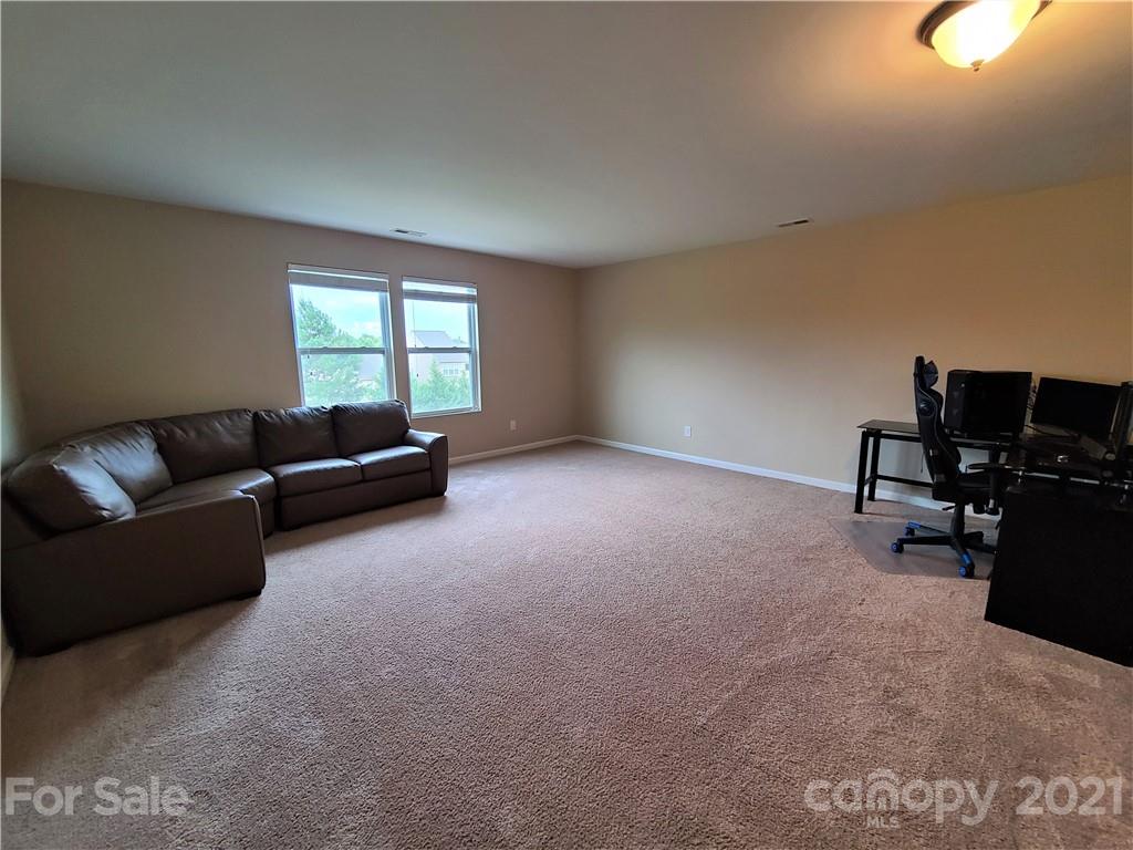 79315 Ridgehaven Road Lancaster, SC 29720 - Photo 23 of 41 a living room with furniture and a flat screen tv