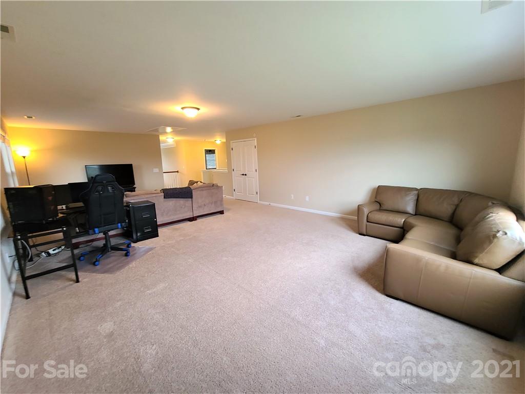79315 Ridgehaven Road Lancaster, SC 29720 - Photo 24 of 41 a living room with furniture and a flat screen tv