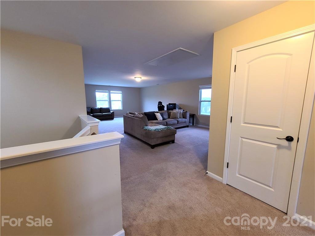 79315 Ridgehaven Road Lancaster, SC 29720 - Photo 26 of 41 a living room with furniture and a flat screen tv