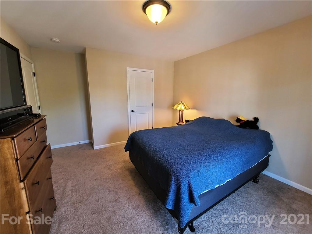 79315 Ridgehaven Road Lancaster, SC 29720 - Photo 28 of 41 a bedroom with a bed and a television