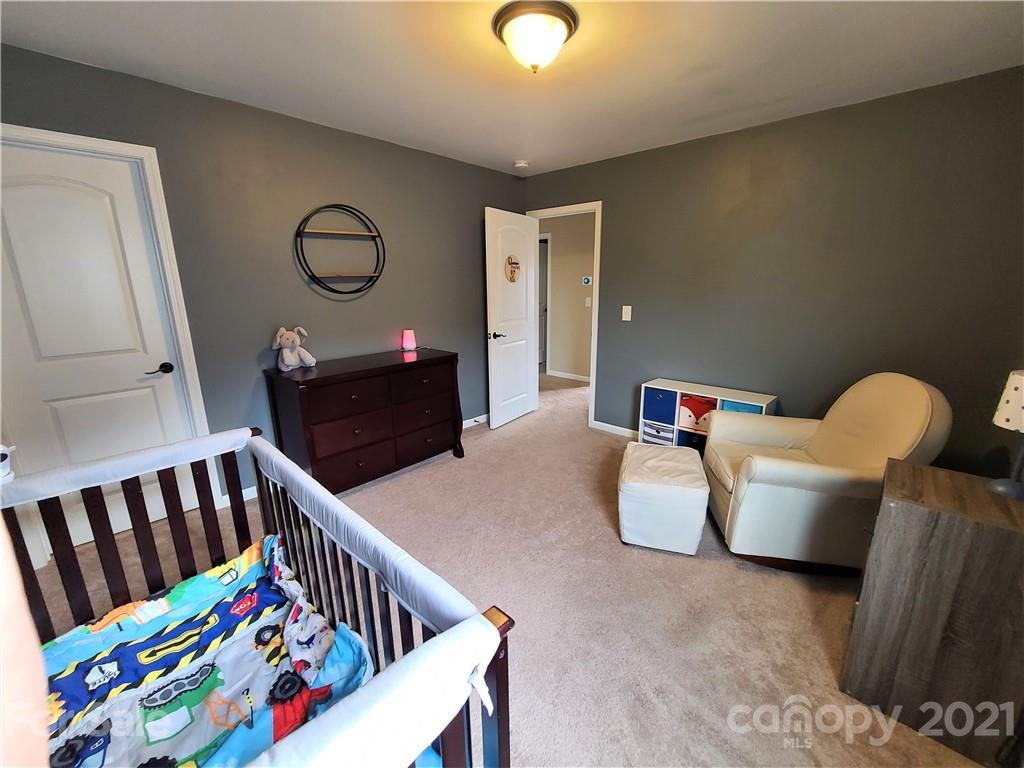 79315 Ridgehaven Road Lancaster, SC 29720 - Photo 32 of 41 a bedroom with furniture and a wooden floor