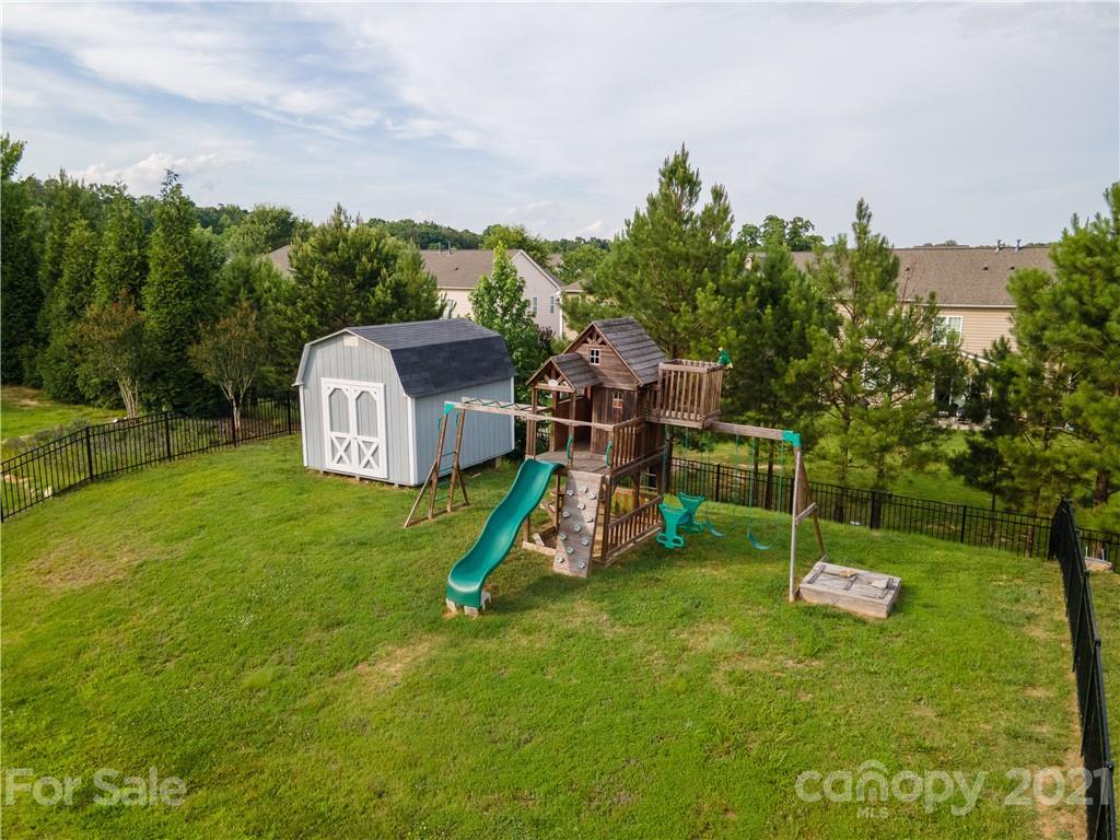 79315 Ridgehaven Road Lancaster, SC 29720 - Photo 6 of 41 a garden view with a sitting space and garden