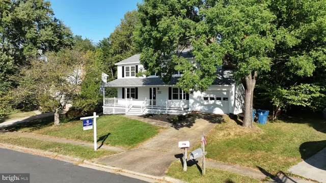 a front view of a house with a yard fountain