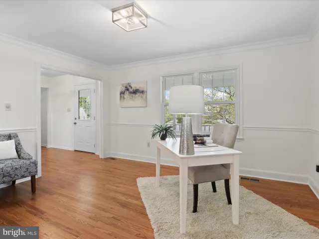 a workspace with furniture and window