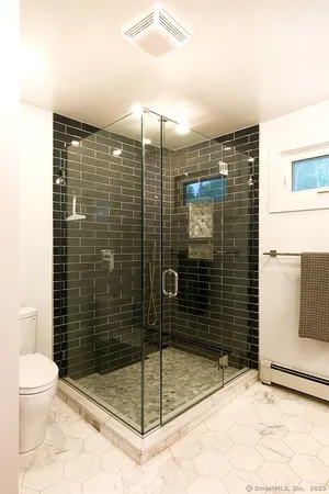 a view of an entryway with wooden floor