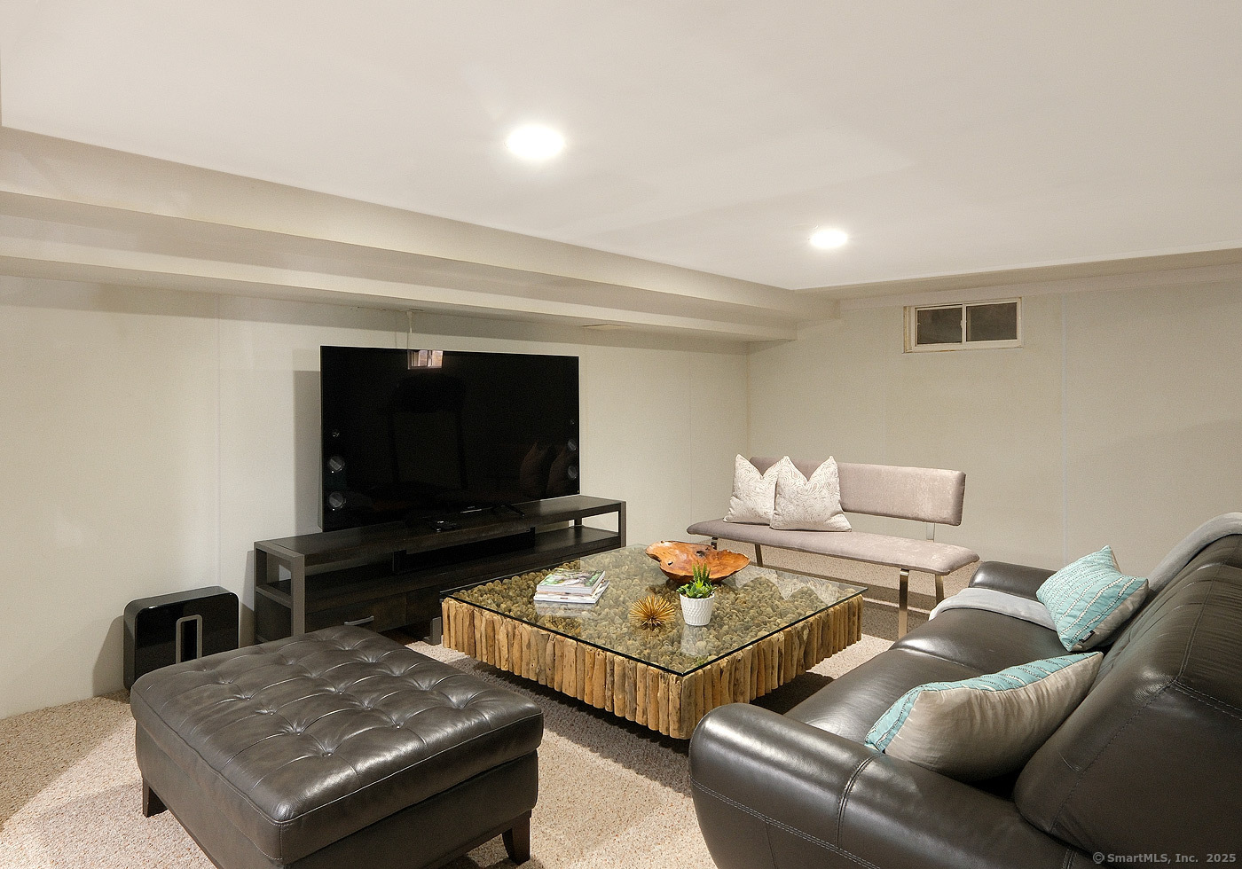 21 Perry Street Salisbury, CT 06039 - Photo 15 of 22 a living room with furniture and a flat screen tv