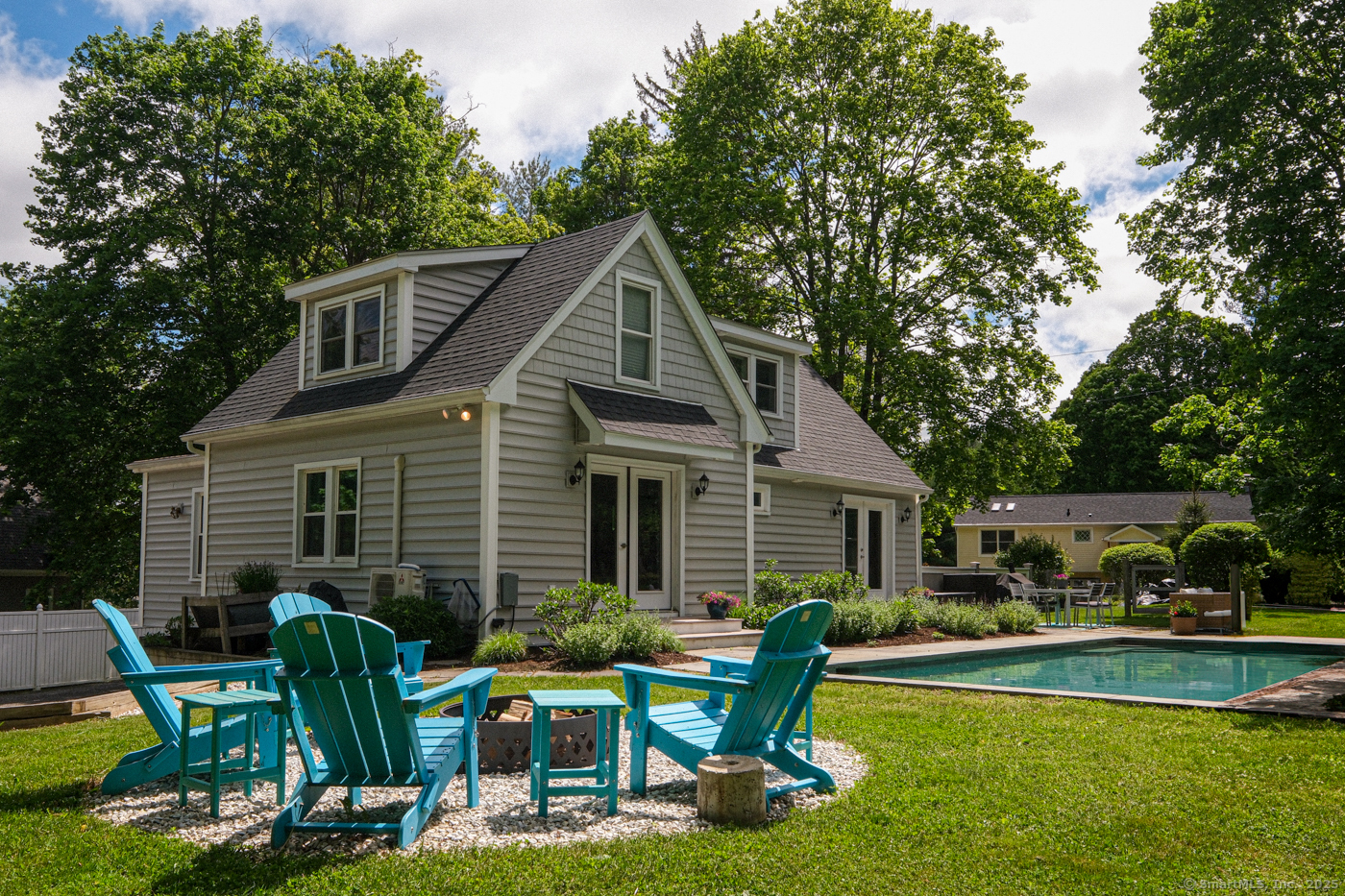 21 Perry Street Salisbury, CT 06039 - Photo 19 of 22 a view of a house with backyard sitting area and swimming pool
