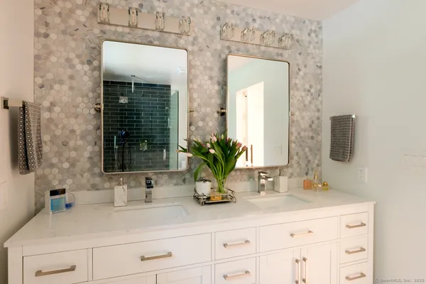 a bathroom with sink and mirror