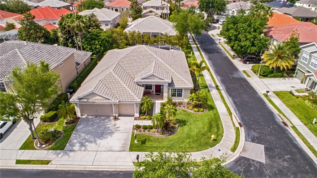 2220 Elizabeth Way Dunedin, FL 34698 - Photo 1 of 1 a aerial view of a house with swimming pool and garden