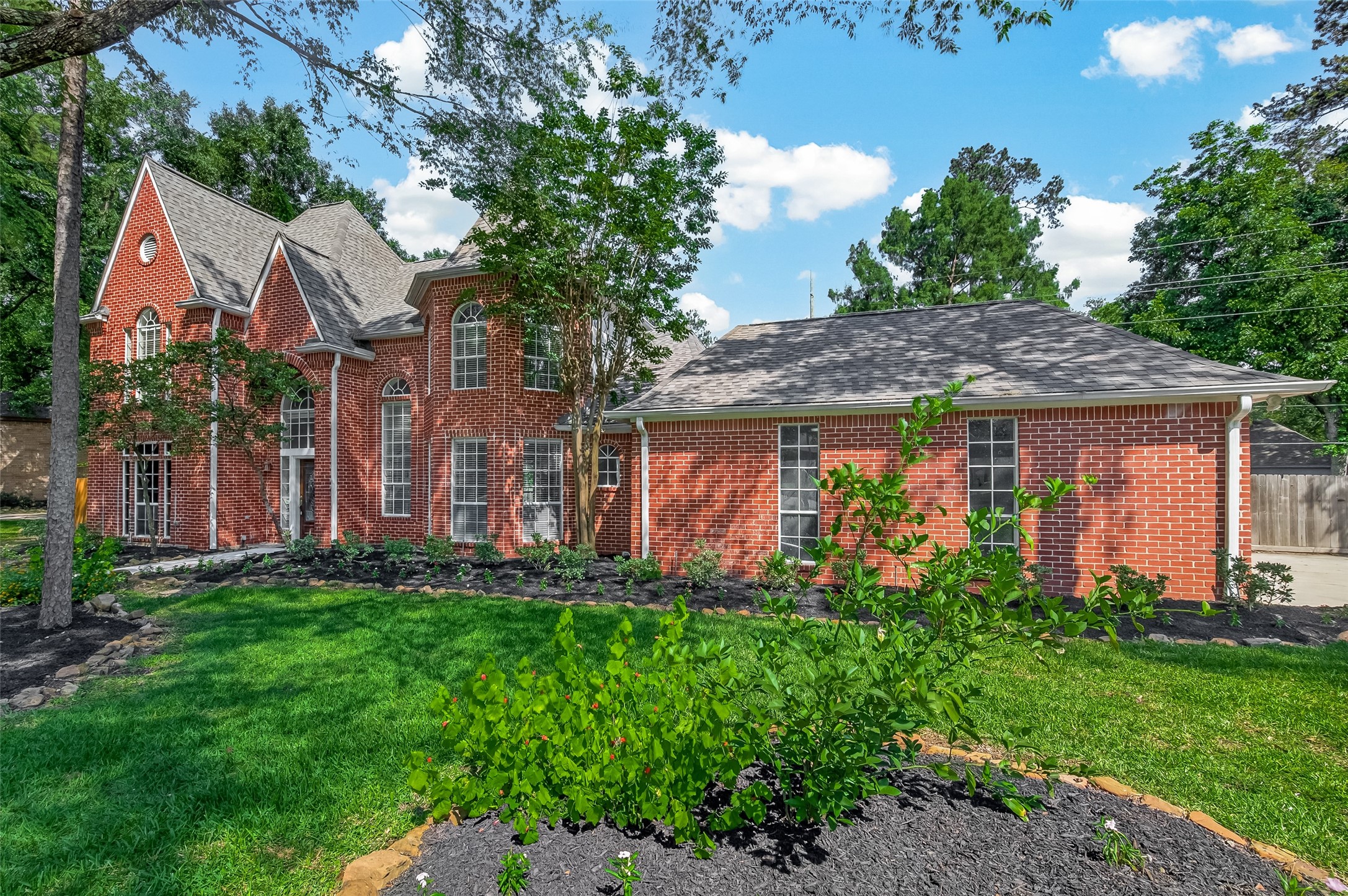 6131 Hampton Way Court Spring, TX 77389 - Photo 2 of 50 a front view of house with a garden