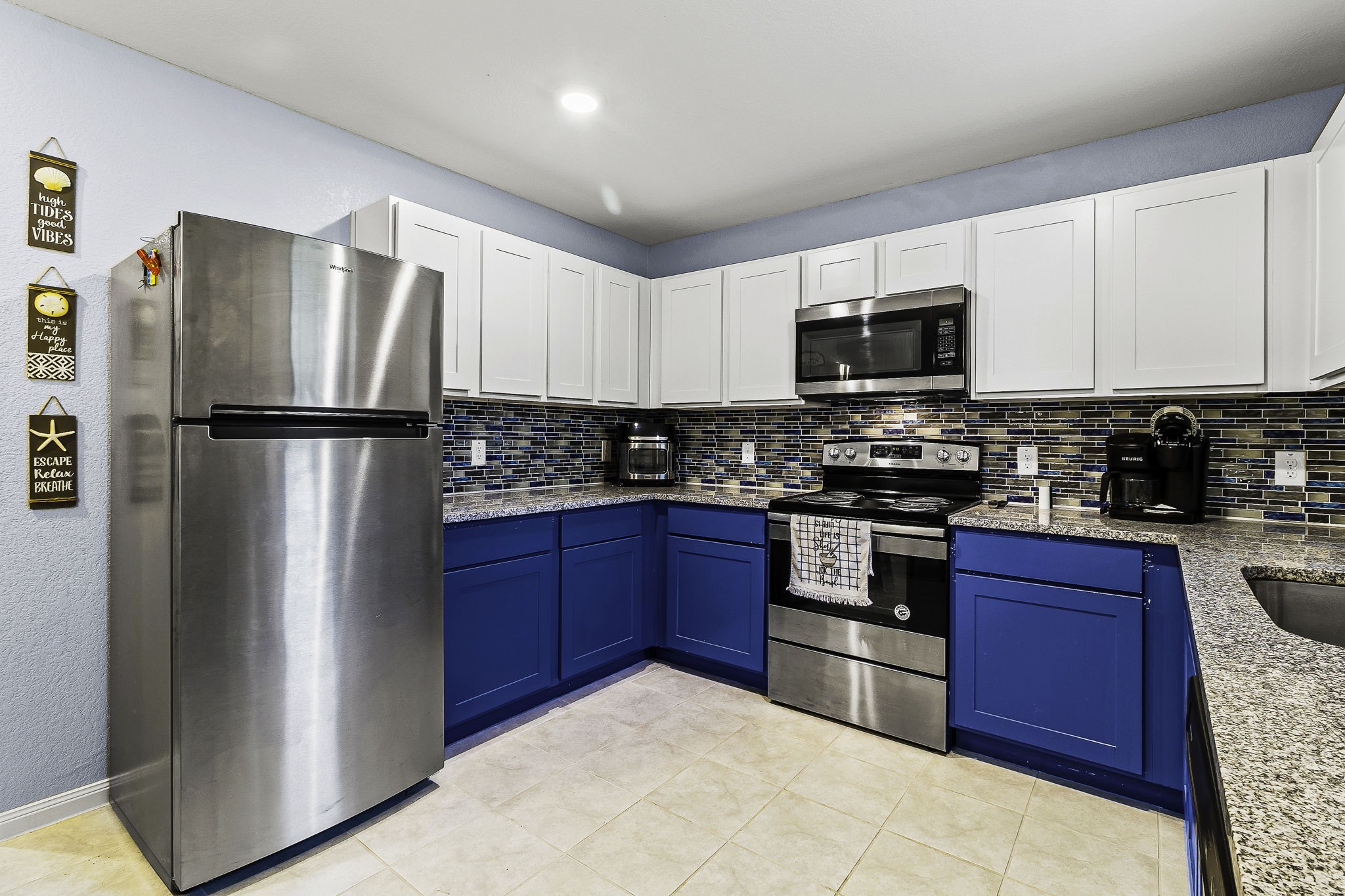 Tb Apple Tree Livingston, TX 77351 - Photo 14 of 31 a kitchen with stainless steel appliances granite countertop a refrigerator stove a sink dishwasher and microwave
