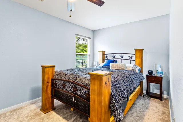 a bedroom with a bed and a dresser in it