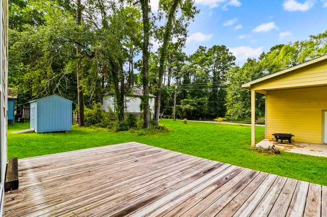 a view of a backyard with sitting area