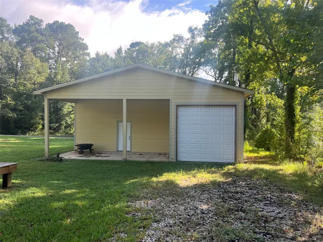 a view of a backyard of the house