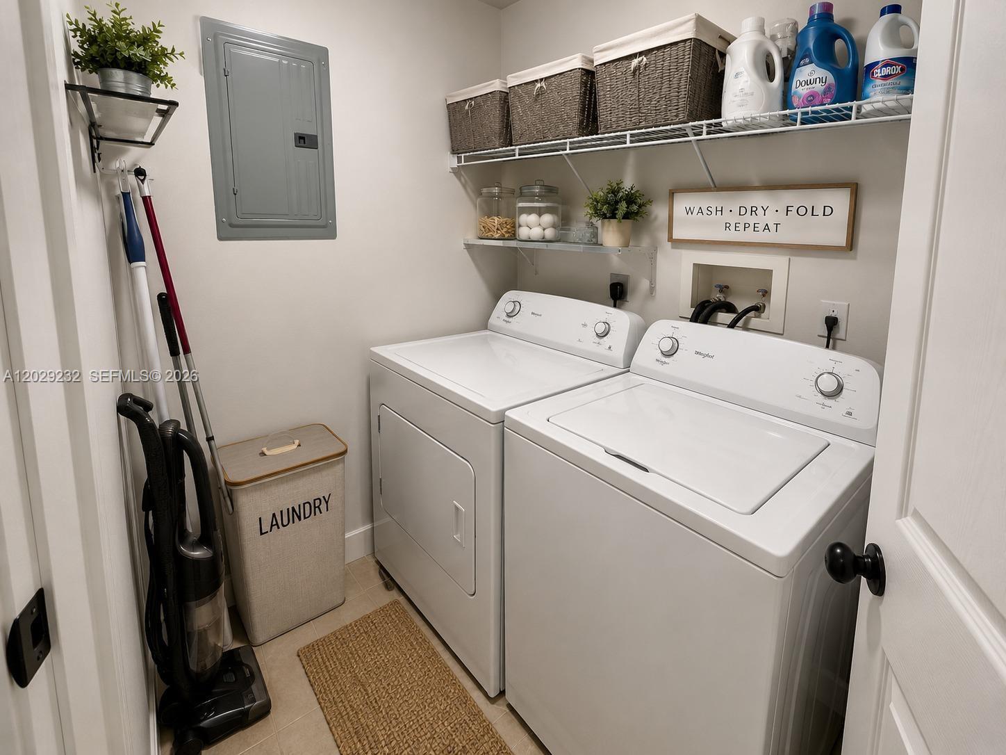 17100 North Bay Road, Unit 1605 Sunny Isles Beach, FL 33160 - Photo 28 of 52 a utility room with dryer and washer
