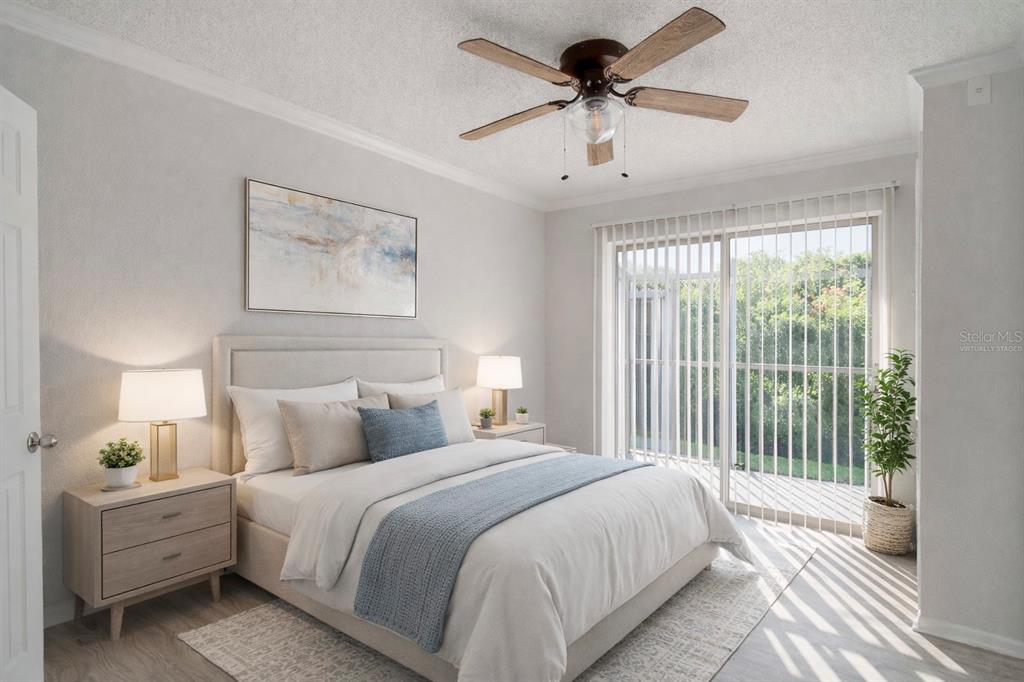 129 Blue Pointe Way, Unit 340 Altamonte Springs, FL 32701 - Photo 11 of 25 a bedroom with a large bed and a chandelier fan