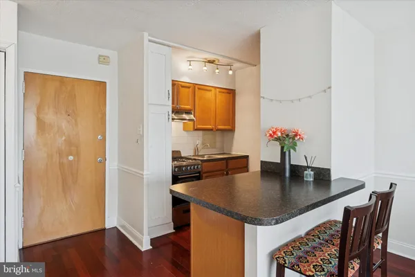 a kitchen with a table and chairs