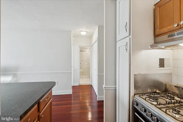 a kitchen with stainless steel appliances granite countertop a stove and a refrigerator