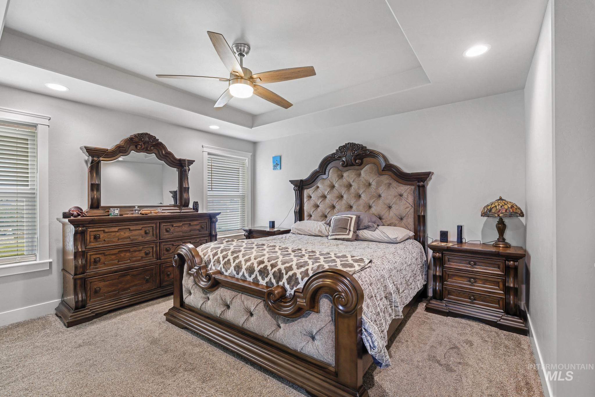 1150 Kimberly Meadows Road Kimberly, ID 83341 - Photo 15 of 32 Bedroom featuring a tray ceiling with recessed lighting and a ceiling fan