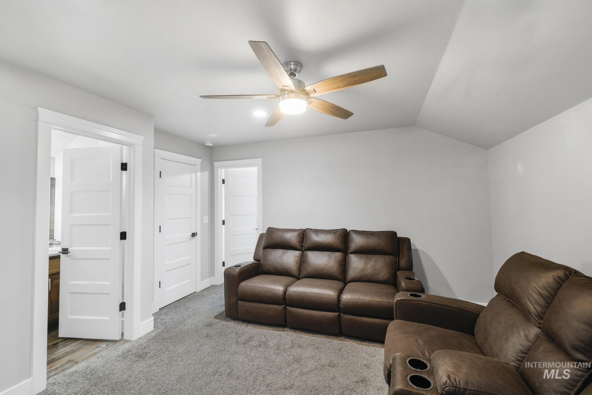 1150 Kimberly Meadows Road Kimberly, ID 83341 - Photo 18 of 32 Carpeted room featuring a ceiling fan with wood-finish blades and integrated lighting