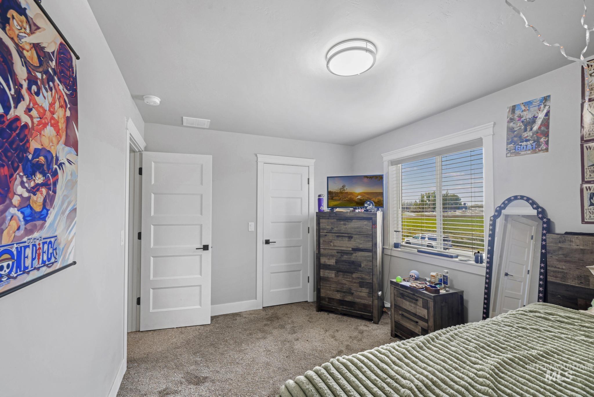 1150 Kimberly Meadows Road Kimberly, ID 83341 - Photo 21 of 32 Carpeted interior with light grey walls and white trim