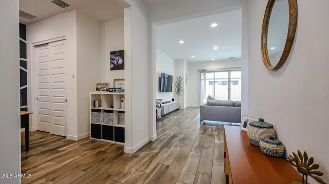 a view of wooden floor and windows in a room
