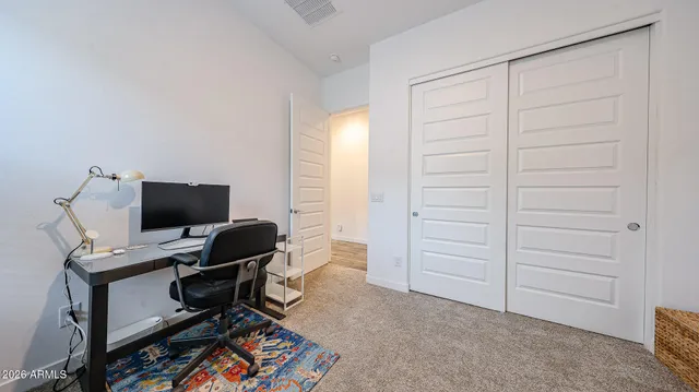 a view of a workspace with furniture