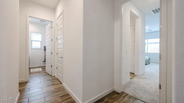 a view of a bathroom from the hallway