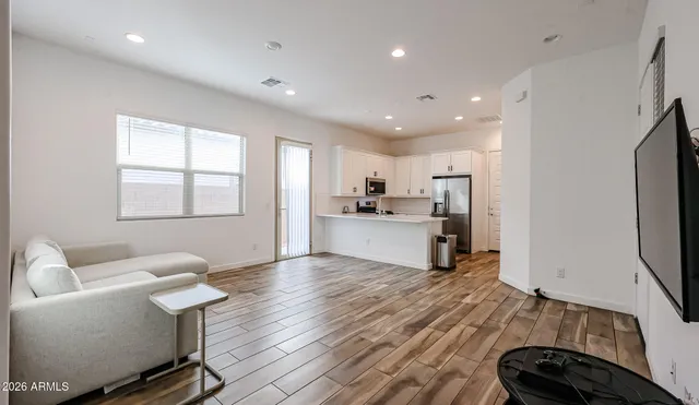 a view of kitchen with cabinets and wooden floor