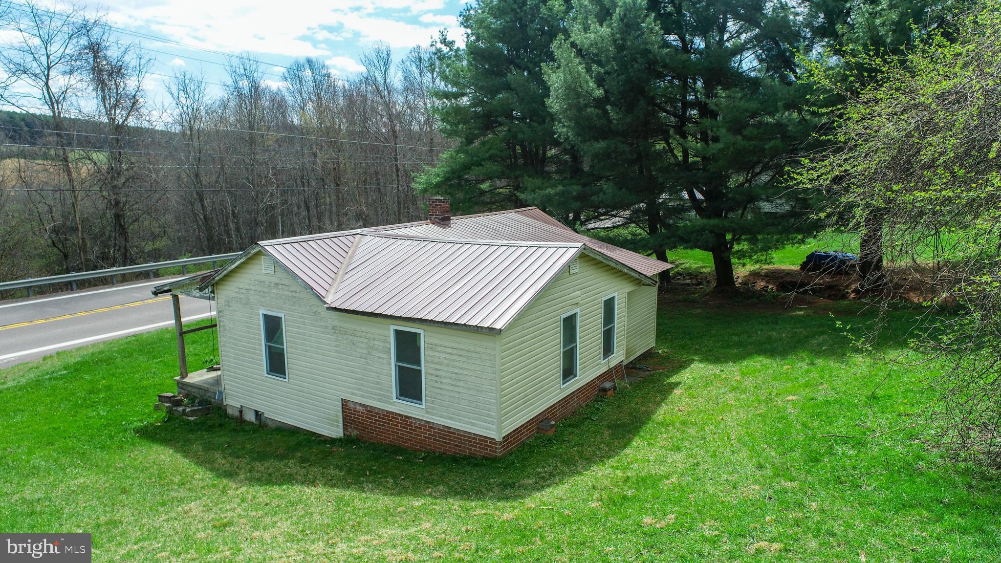 10785 Friendsville Road Friendsville, MD 21531 - Photo 3 of 19 a aerial view of a house with a yard table and chairs