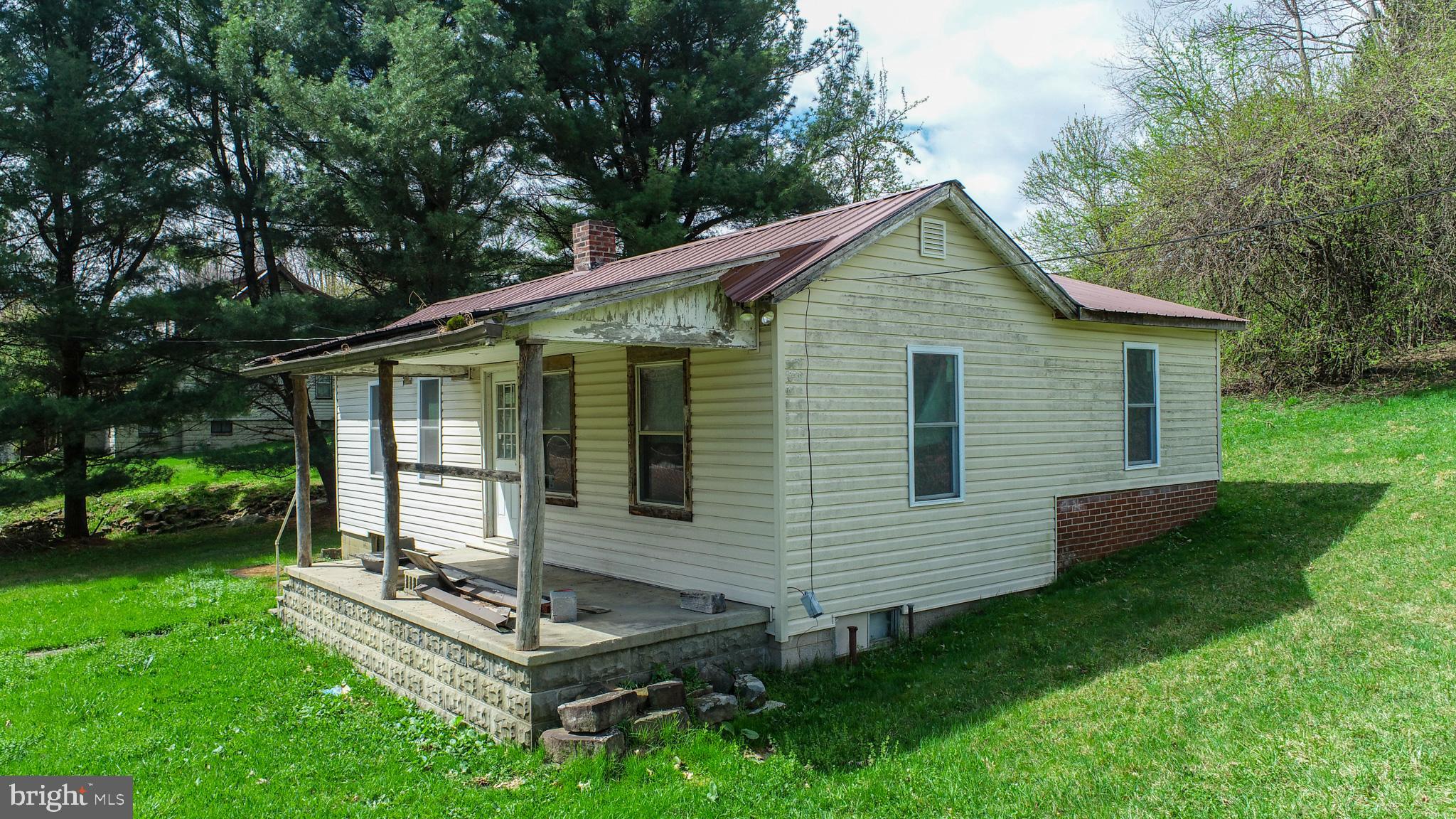 10785 Friendsville Road Friendsville, MD 21531 - Photo 4 of 19 front view of a house with a yard